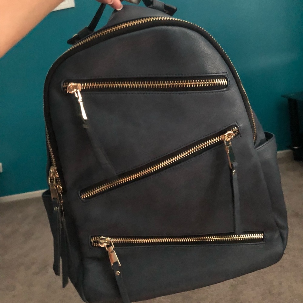 BLUE ZIPPERED BACKPACK WITH GOLD DETAILING